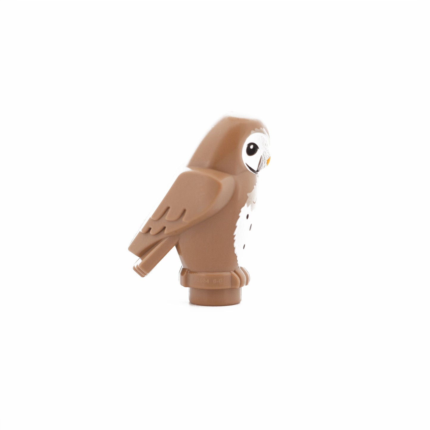 Dark Tan Owl, Angular Features with Bright Light Orange Beak, Black Eyes, and Tan and White Chest Feathers Pattern