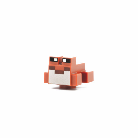 Dark Orange Minecraft Frog with Black and Yellowish Green Eyes, Reddish Brown Mouth, Tan Vocal Sac Pattern